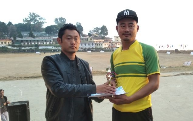 Thungjanbemo T Humtsoe giving away the man of the match award to Nchumthung Ngullie of Maveric (A).